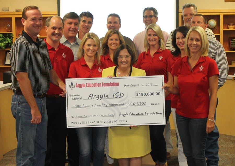 AEF supporters presenting a contribution to Argyle ISD in 2016